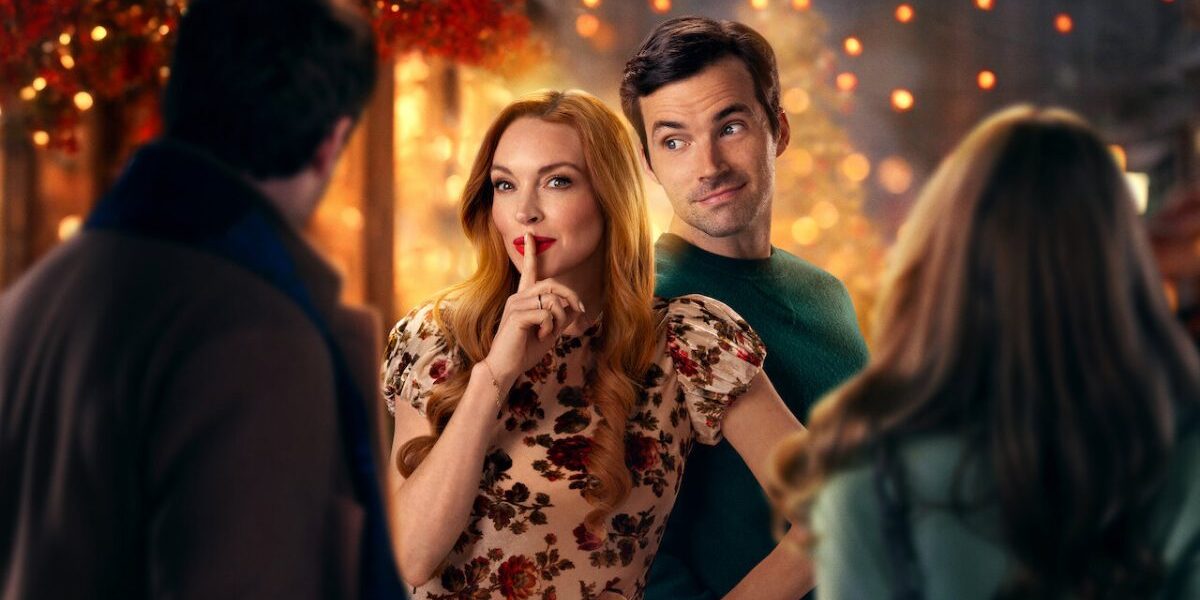 Nosso Segredinho | Filme com Lindsay Lohan Chega ao Topo do Ranking da Netflix Imagem promocional da Netflix para "Nosso Segredinho", longa de Natal com Lindsay Lohan. Na imagem, a protagonista faz sinal de silêncio, como quem pede segredo, enquanto sorri maliciosamente à câmera. Seu interesse romântico está ao lado, olhando-a de rosto virado e um sorriso de rosto.