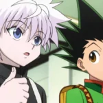 Killua Zoldyck e Gon Freecss, da esquerda para a direita, do anime Hunter x Hunter. Killua olha para um outro personagem à direita da câmera, enquanto Gon olha para Killua falando.