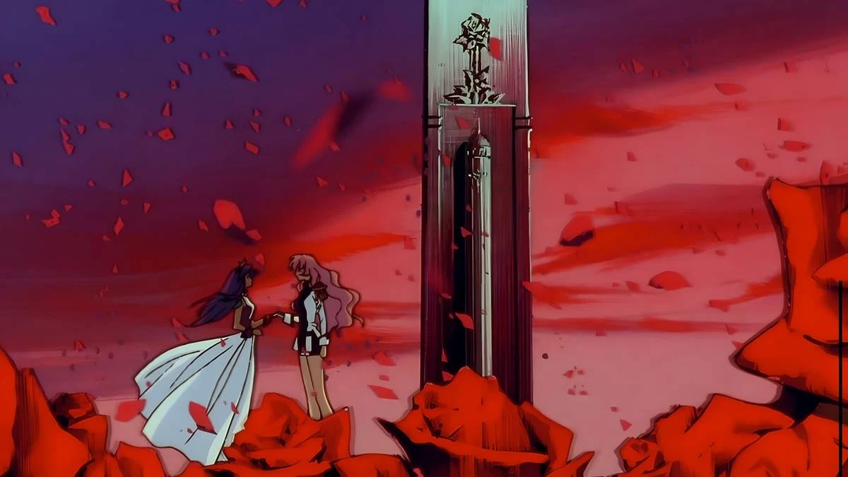 Utena e Anthy, à esquerda, meio a um campo de rosas com pétalas esvoaçantes em um fim de tarde no anime "Shoujo Kakumei Utena".