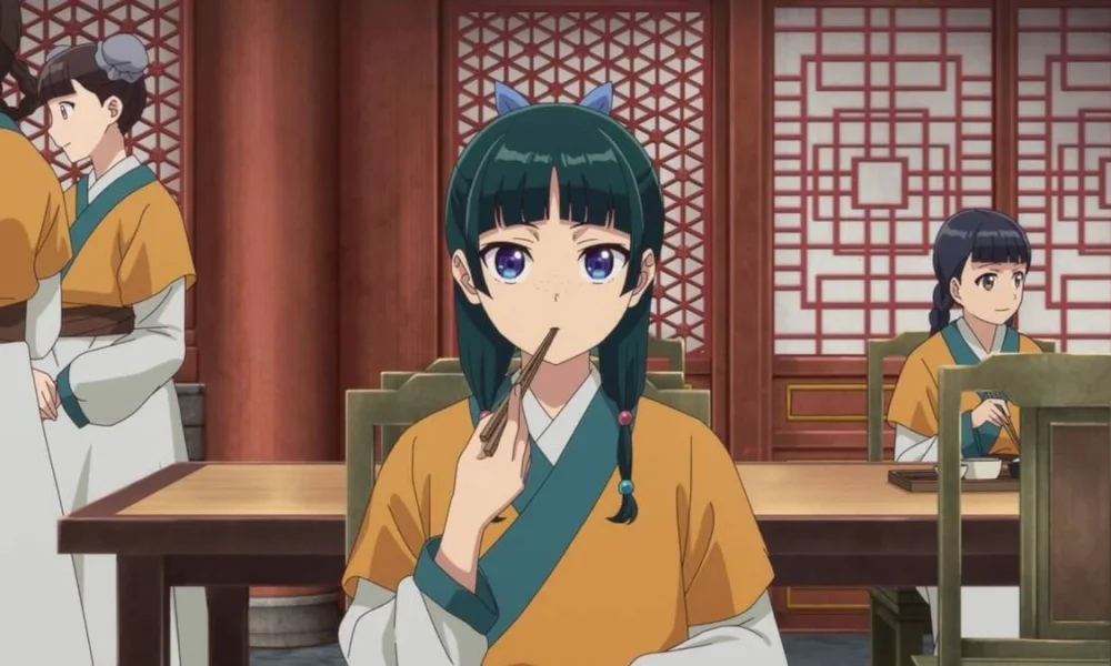 Protagonista de "The Apothecary Diaries" centralizada pela câmera comendo no palácio.