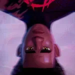 Miles Morales, de cabeça pra baixo, suavemente desfocado em um fundo púrpura claro suavemente batido. Uma das primeiras imagens do novo longa do Aranhaverso.