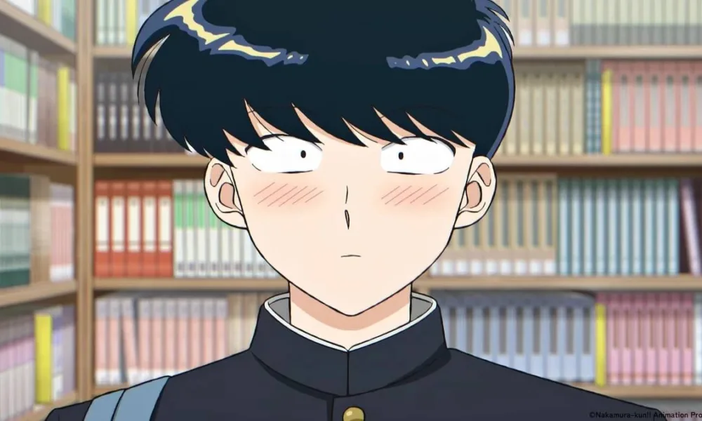 Protagonista Nakamura do anime "Go For It, Nakamura-kun!" visto centralizado na tela, corado, com uma biblioteca de fundo.