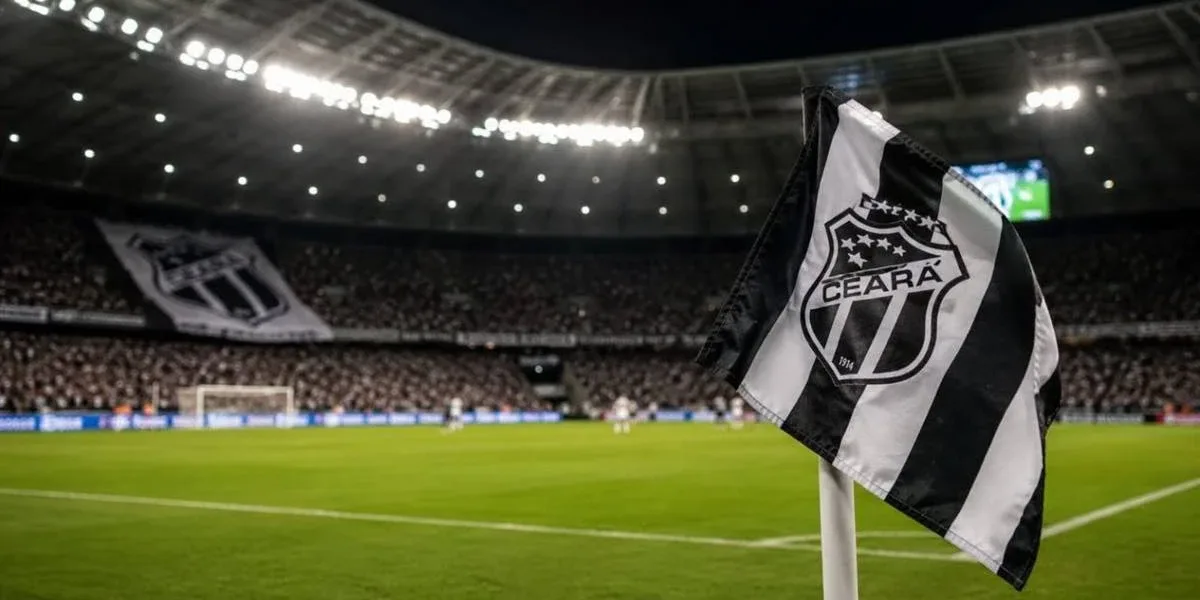 Ceará se Pronuncia Sobre Situação de Vina e Pedro Henrique em Meio a Rumores nos Bastidores Bandeira do Ceará em riste em campo de futebol de noite durante partida, em destaque. Imagem gerada por IA.