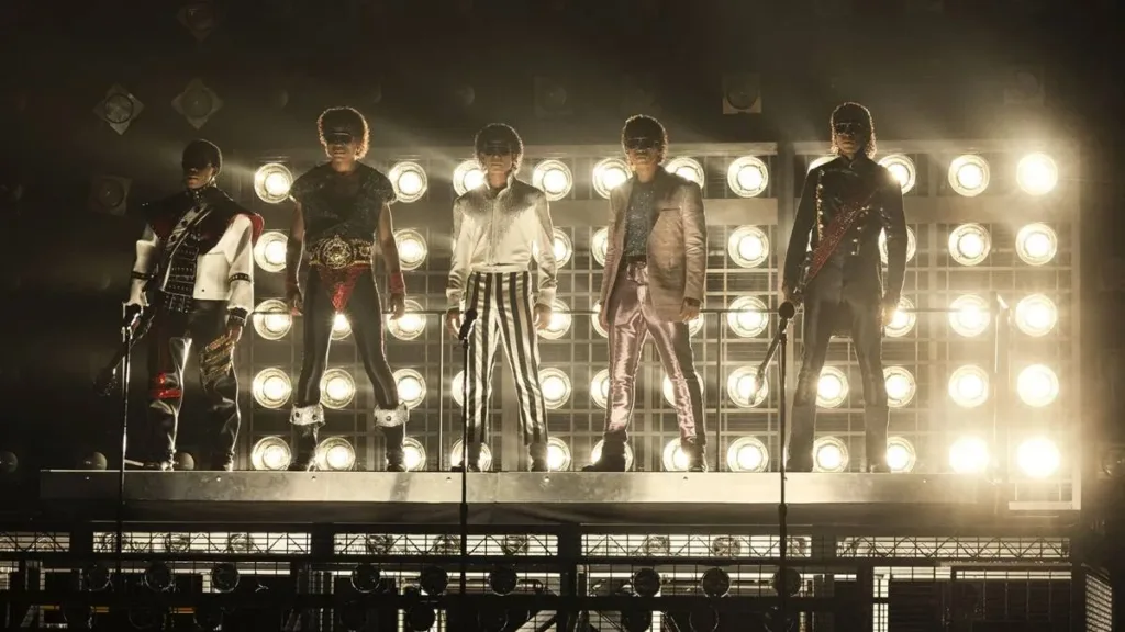 IEsta é uma imagem do filme biográfico "Michael", lançado em 2026, retratando o grupo The Jackson 5 em sua icônica Victory Tour.
