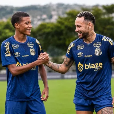 Robinho Jr. (esquerda) e Neymar (direita) cumprimentando um ao outro com mãos direitas. Imagem gerada por inteligência artificial.