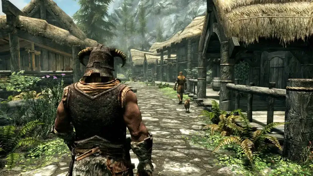 Por Que "The Elder Scrolls V: Skyrim" Ainda é Um Refúgio Emocional 1 Paisagem de "The Elder Scrolls V: Skyrim", dragonborn em destaque, de costas caminhando, em vila.