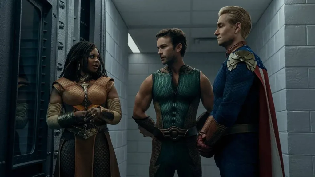 Esta imagem mostra os personagens Capitão Pátria, Profundo e Mana Sábia da série The Boys no episódio 7 da 5ª temporada de The Boys.